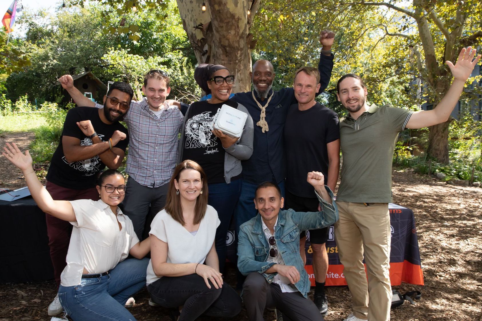 community posing for photo in celebration